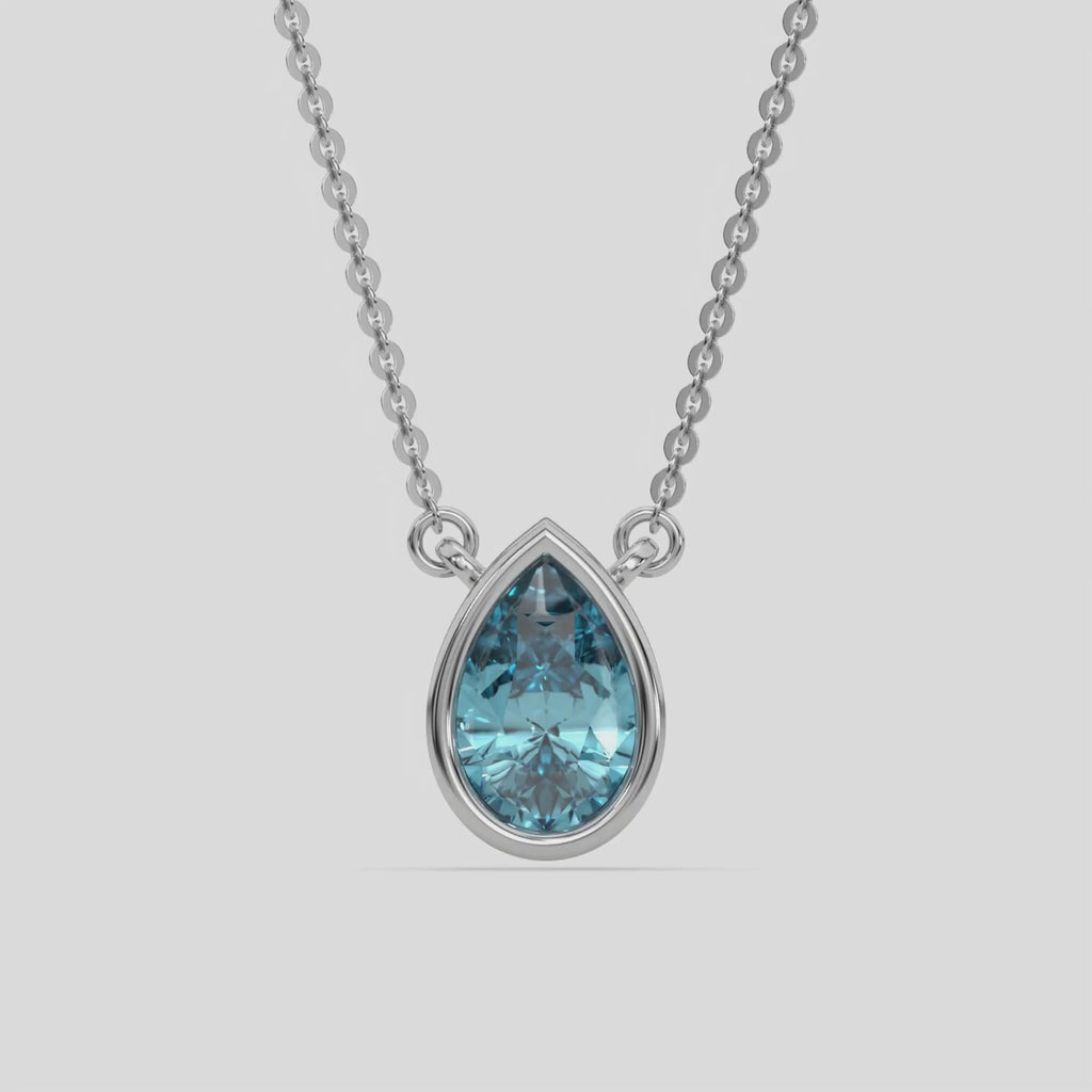  Fancy Blue Pear Solitaire Diamond Necklace made with a fancy Blue pear cut diamond in bezel setting with adjustable chain 