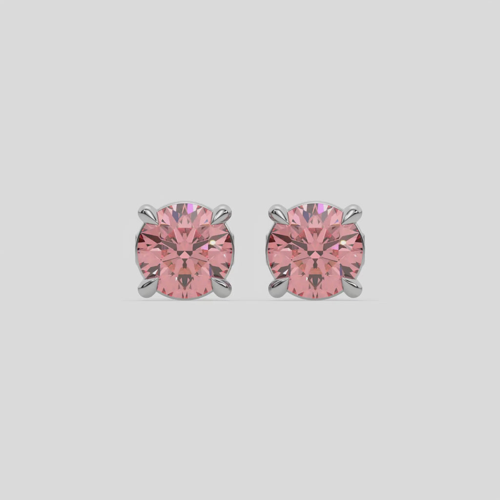 This video features a white gold Classic Round Diamond Studs made with fancy pink round brilliant-cut diamonds set in a four prong setting