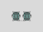 14k white gold Radiant Diamond Earrings made with a fancy green radiant cut diamond set in a four prong setting