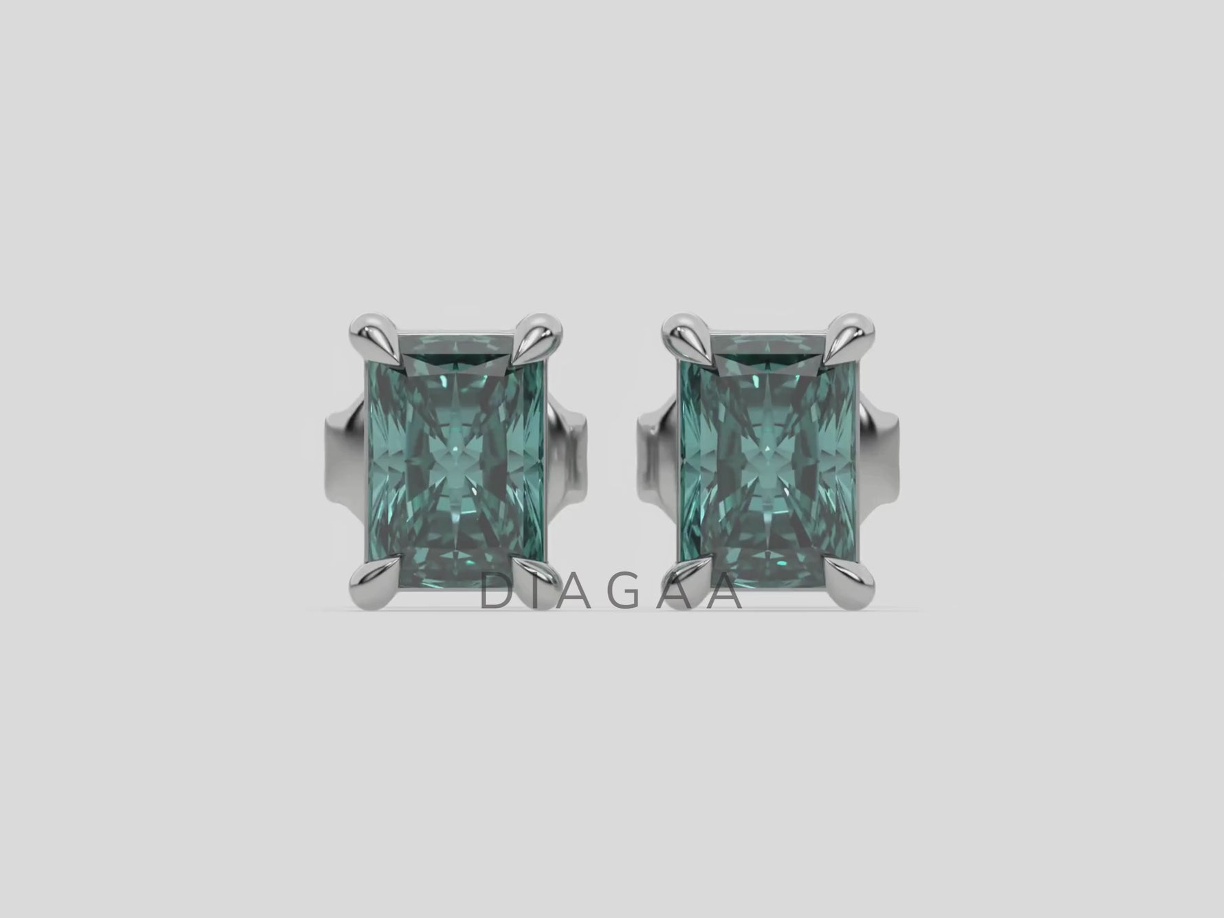 14k white gold Radiant Diamond Earrings made with a fancy green radiant cut diamond set in a four prong setting