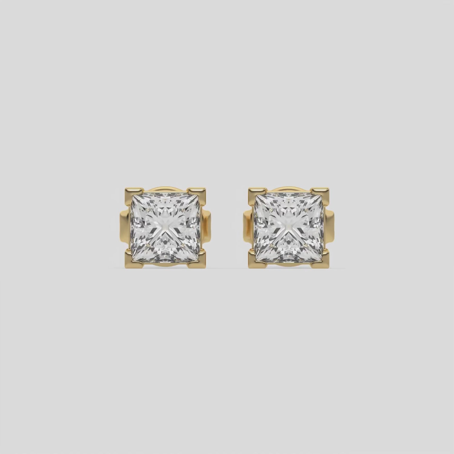 This video features a yellow gold Classic Princess Diamond Earrings made with a princess-cut diamonds set in a four v-prong setting