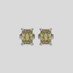 This video features a white gold Classic Radiant Diamond Earrings made with a fancy yellow radiant-cut diamonds set in a four prong setting