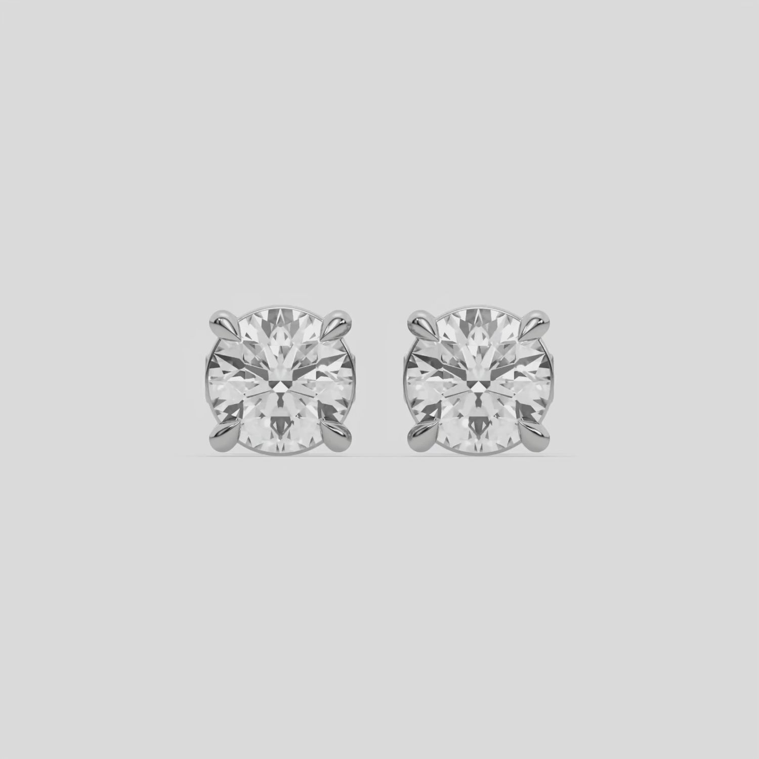 This video features a white gold Classic Round Diamond Studs made with round brilliant-cut diamonds set in a four prong setting