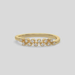 This video features a yellow gold Zig Zag Round Diamond Ring handmade with round brilliant-cut diamonds, each set individually in a four prong setting and arranged in a zig zag pattern