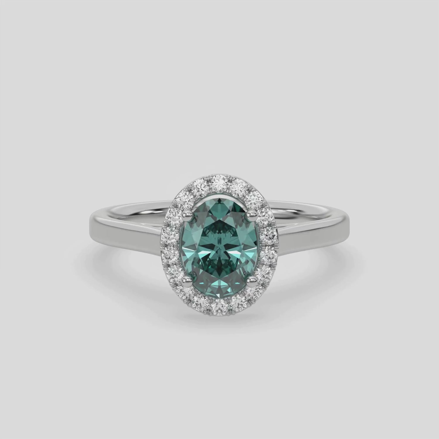 This video features a white gold ring is made with an fancy Green oval solitaire diamond set in a four-prong setting