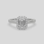 This video features a white gold ring is made with an emerald solitaire diamond set in a four-prong setting 