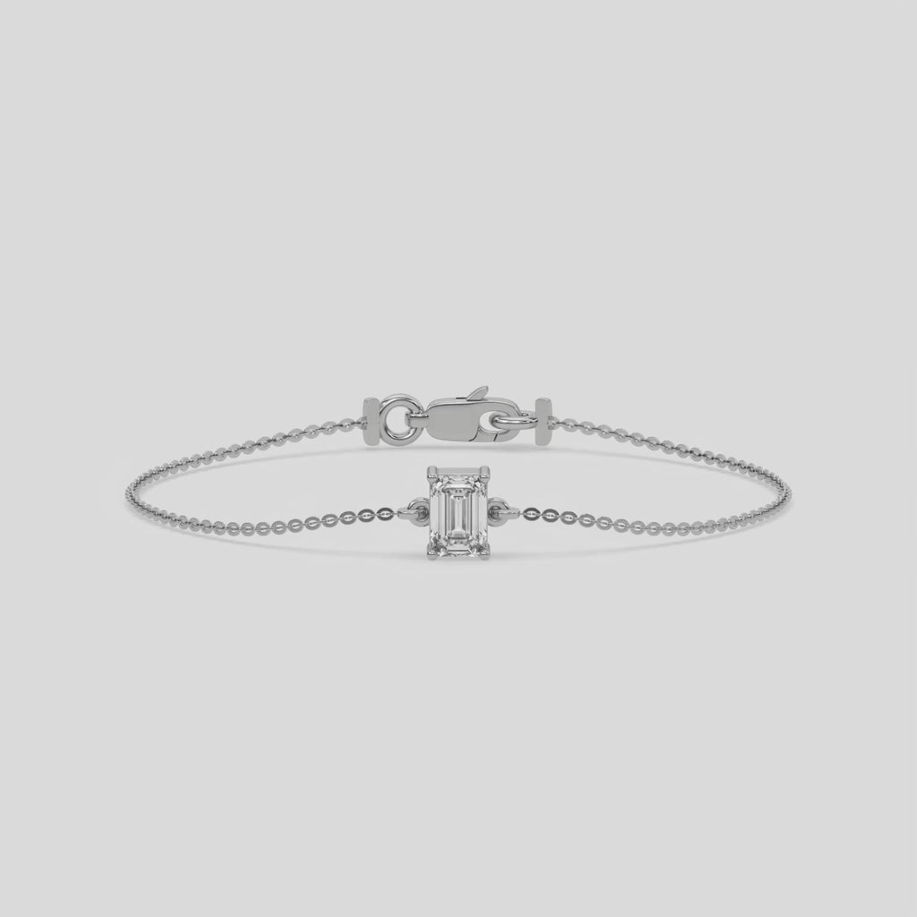 This video features a Solitaire Emerald Diamond Bracelet made with emerald cut diamond, securely set in prong setting