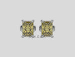 10k white gold Radiant Diamond Earrings made with a fancy yellow radiant cut diamond set in a four prong setting