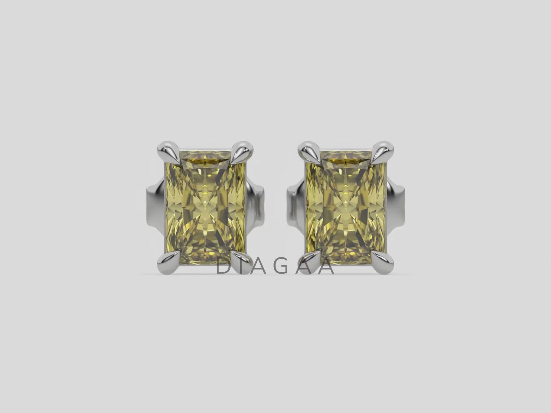 10k white gold Radiant Diamond Earrings made with a fancy yellow radiant cut diamond set in a four prong setting