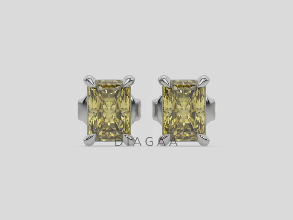 10k white gold Radiant Diamond Earrings made with a fancy yellow radiant cut diamond set in a four prong setting
