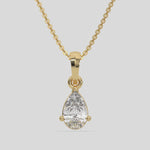 This yellow gold Pear Solitaire Diamond Necklace made with a pear cut diamond in a four prong setting with adjustable chain 