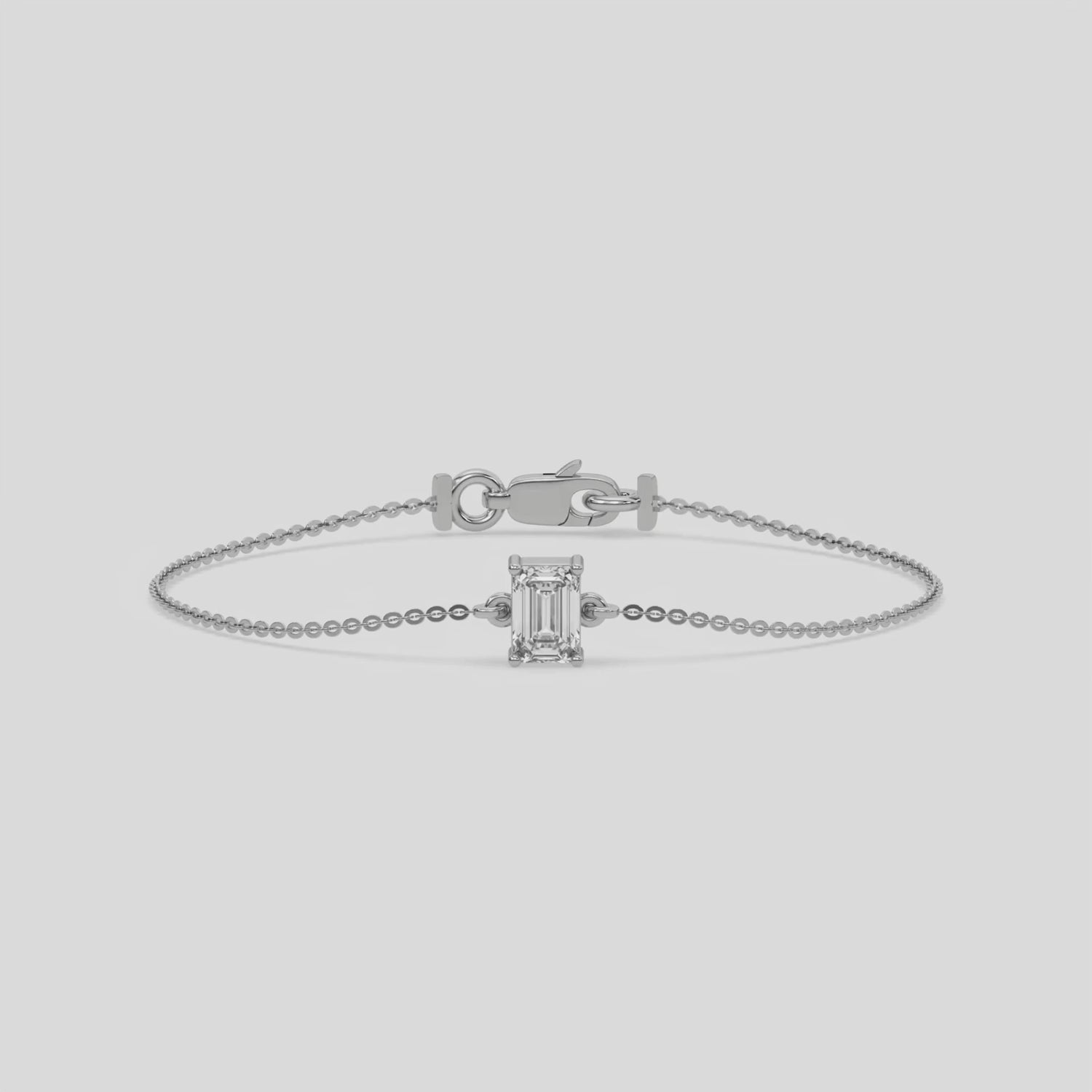 This video features a Solitaire Emerald Diamond Bracelet made with emerald cut diamond, securely set in prong setting