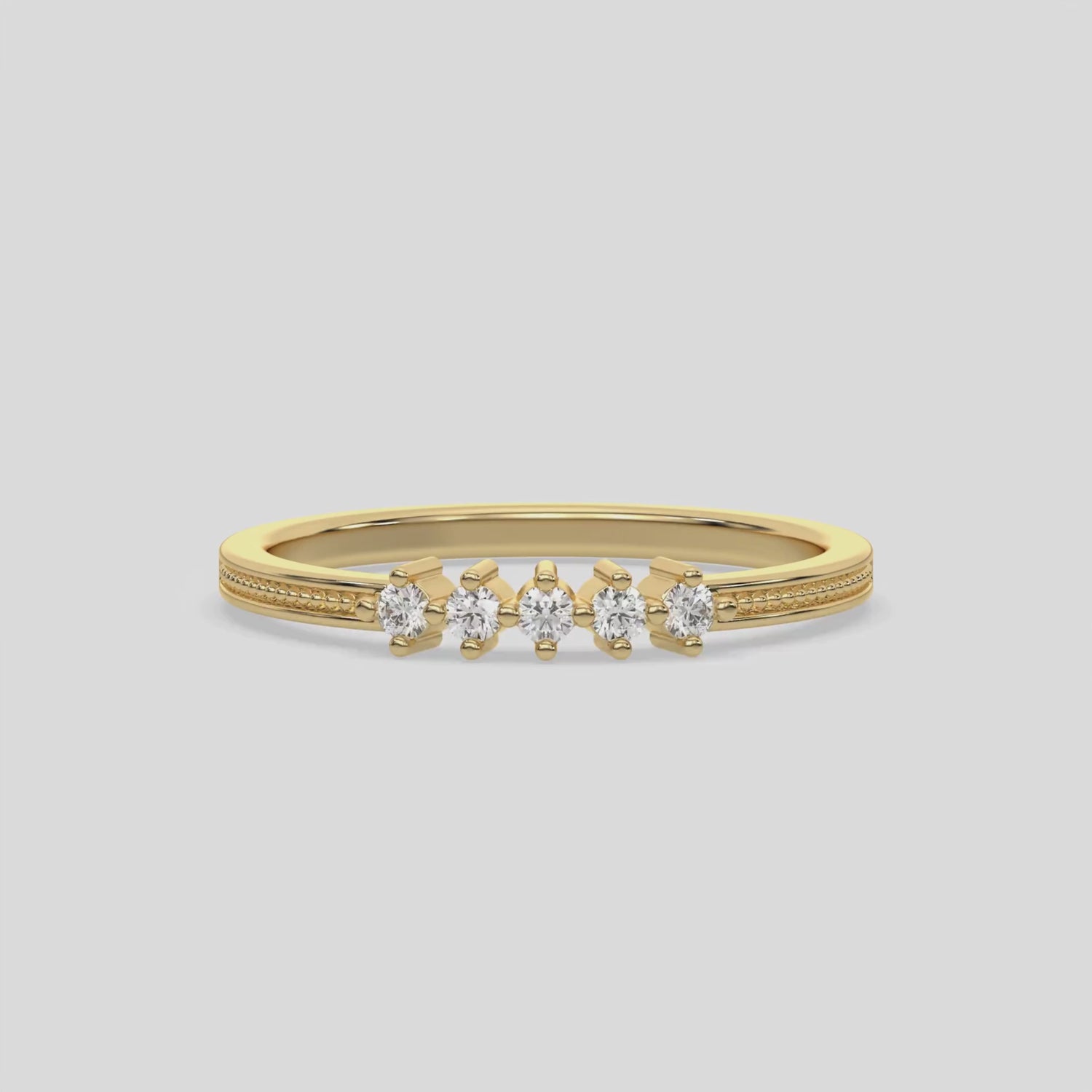 This video features a yellow gold 5 Round Diamond Ring handmade with five round brilliant-cut diamonds and set in a shared four prong setting with milgrain detailing on the band