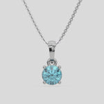  Fancy Blue Round Solitaire Diamond Necklace made with fancy Blue round brilliant-cut diamond in a four prong setting with adjustable chain 