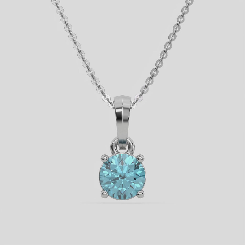  Fancy Blue Round Solitaire Diamond Necklace made with fancy Blue round brilliant-cut diamond in a four prong setting with adjustable chain 