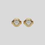 This video features a yellow gold Classic Round Diamond Studs made with round brilliant-cut diamonds and set in an octagonal bezel setting