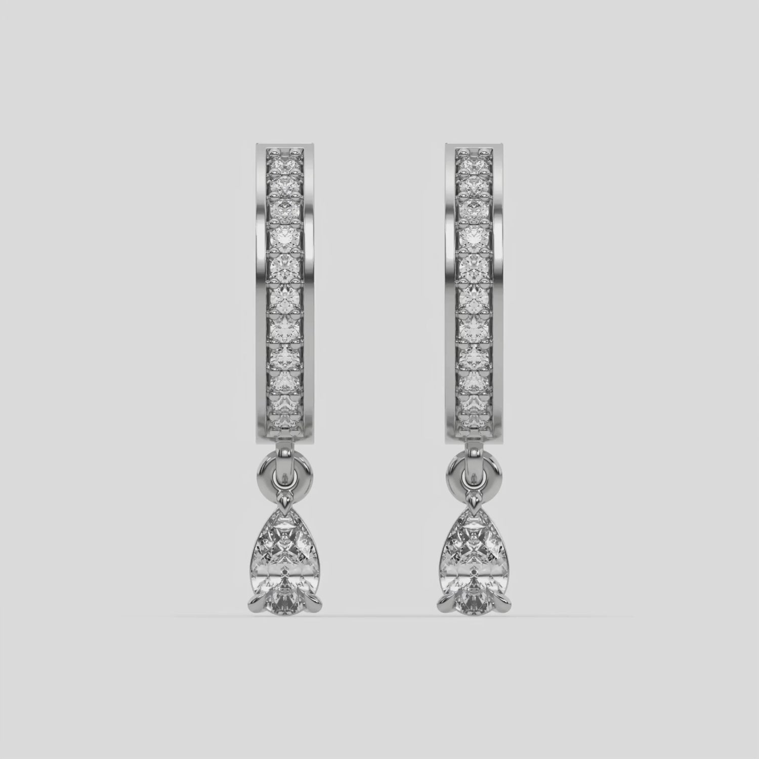 This video features a white gold Dangling Pear Diamond Hoop Earrings handmade with round brilliant-cut diamonds in pave setting