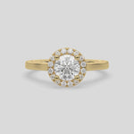 This video features a yellow gold ring features a Round solitaire diamond set in a four-prong setting, surrounded by a halo of round diamonds, all resting on a delicate gold band