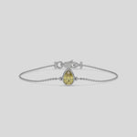 Fancy Yellow Solitaire Pear Diamond Bracelet made with fancy yellow Pear-cut diamond, securely set in bezel setting