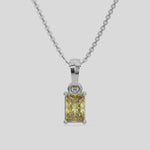  Fancy Yellow Radiant Solitaire Diamond Necklace made with fancy radiant cut diamond in a four prong setting with adjustable chain