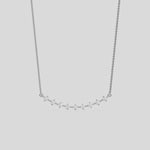 Curved Bar Diamond Necklace made with nine round brilliant-cut diamond in two prong setting with distance between each diamond