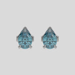 This video features a white gold Classic Pear Diamond Earrings made with a fancy blue pear-cut diamonds set in a four prong setting