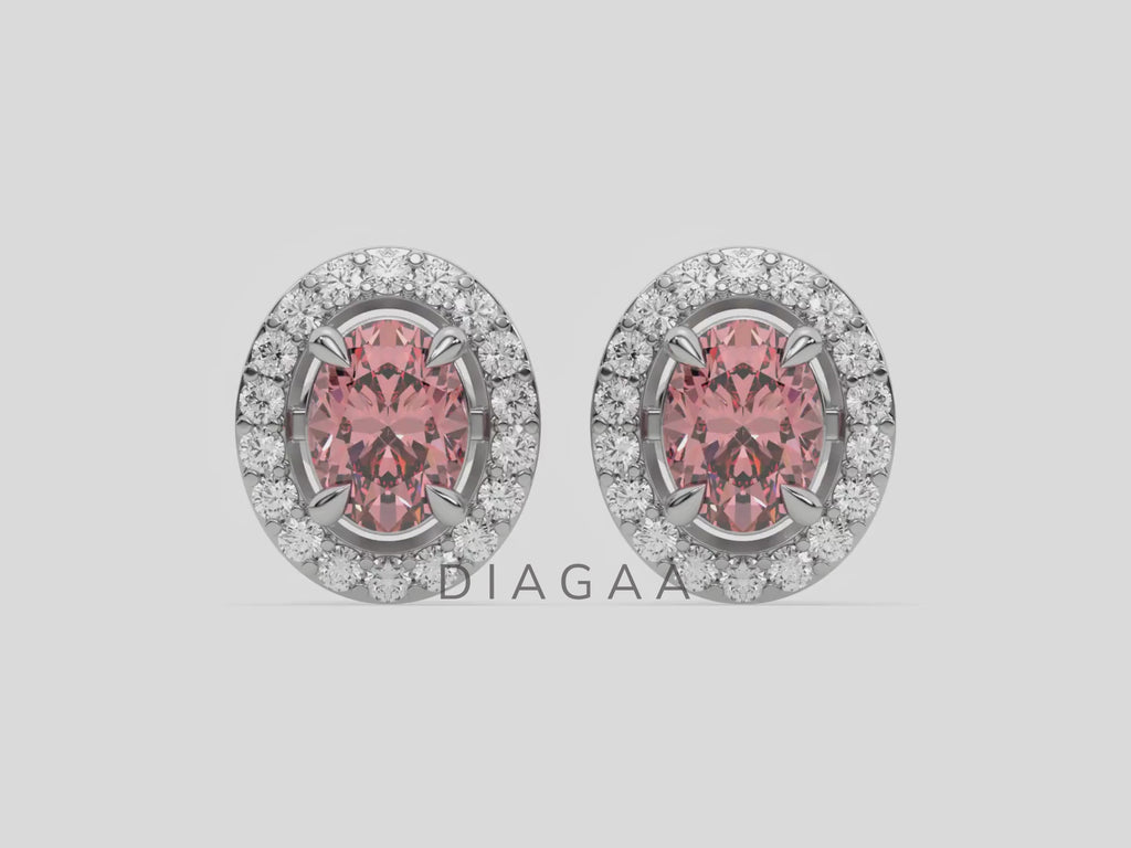 18k white gold Oval Diamond Halo Earrings made with an fancy pink oval cut solitaire diamonds set in a four prong setting