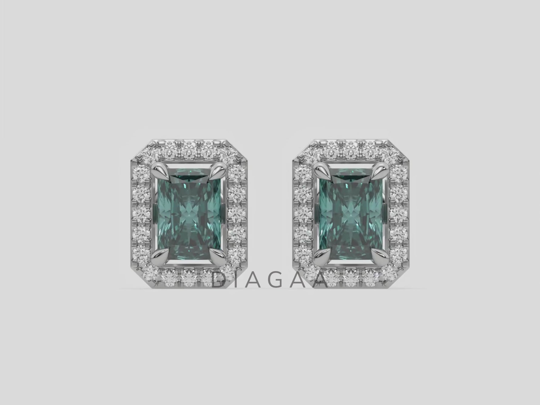 18k white gold Radiant Diamond Halo Earrings made with a fancy green radiant cut solitaire diamonds set in a four prong setting