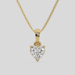  Heart Solitaire Diamond Necklace made with a heart cut diamond in a four prong setting with adjustable chain 