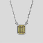 This white gold Fancy Yellow Emerald Solitaire Diamond Necklace made with an fancy yellow emerald cut diamond in bezel setting with adjustable chain 