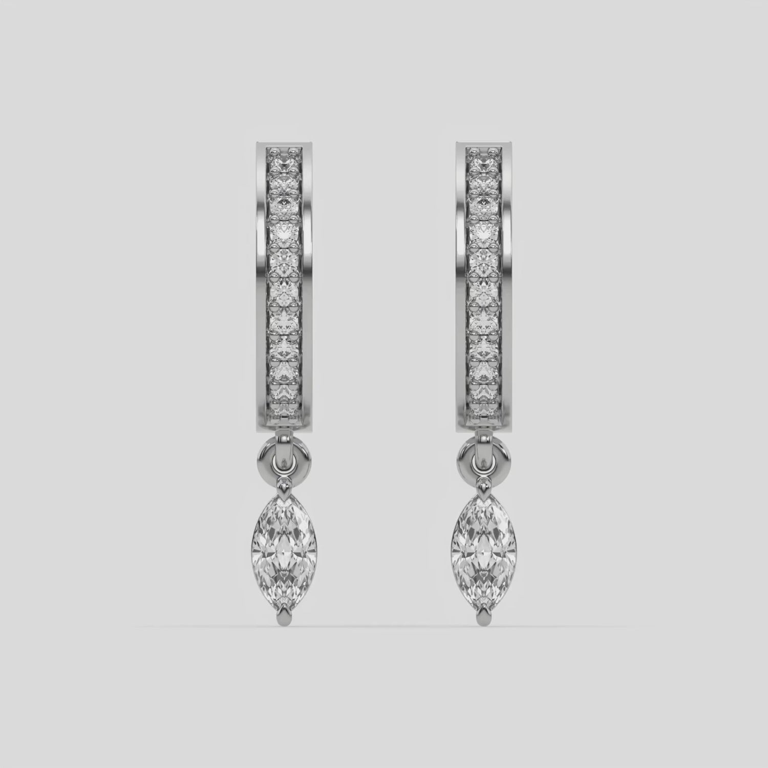 This video features a white gold Dangling Marquise Diamond Hoop Earrings handmade with round brilliant-cut diamonds in pave setting and a marquise solitaire hanging at the bottom