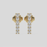 This video features a yellow gold Bar Diamond Earrings made with small round brilliant-cut diamonds set horizontally in shared prong setting