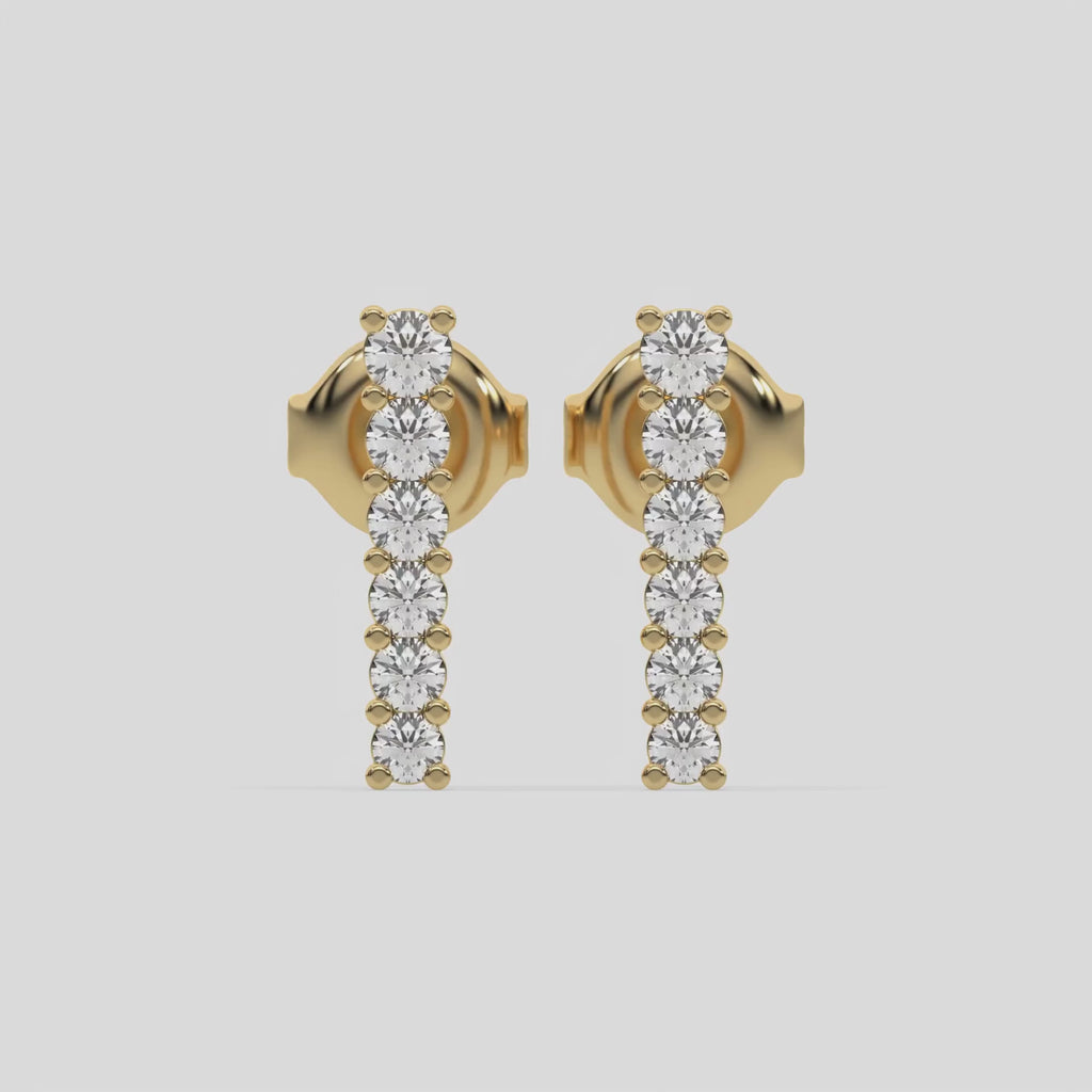 This video features a yellow gold Bar Diamond Earrings made with small round brilliant-cut diamonds set horizontally in shared prong setting