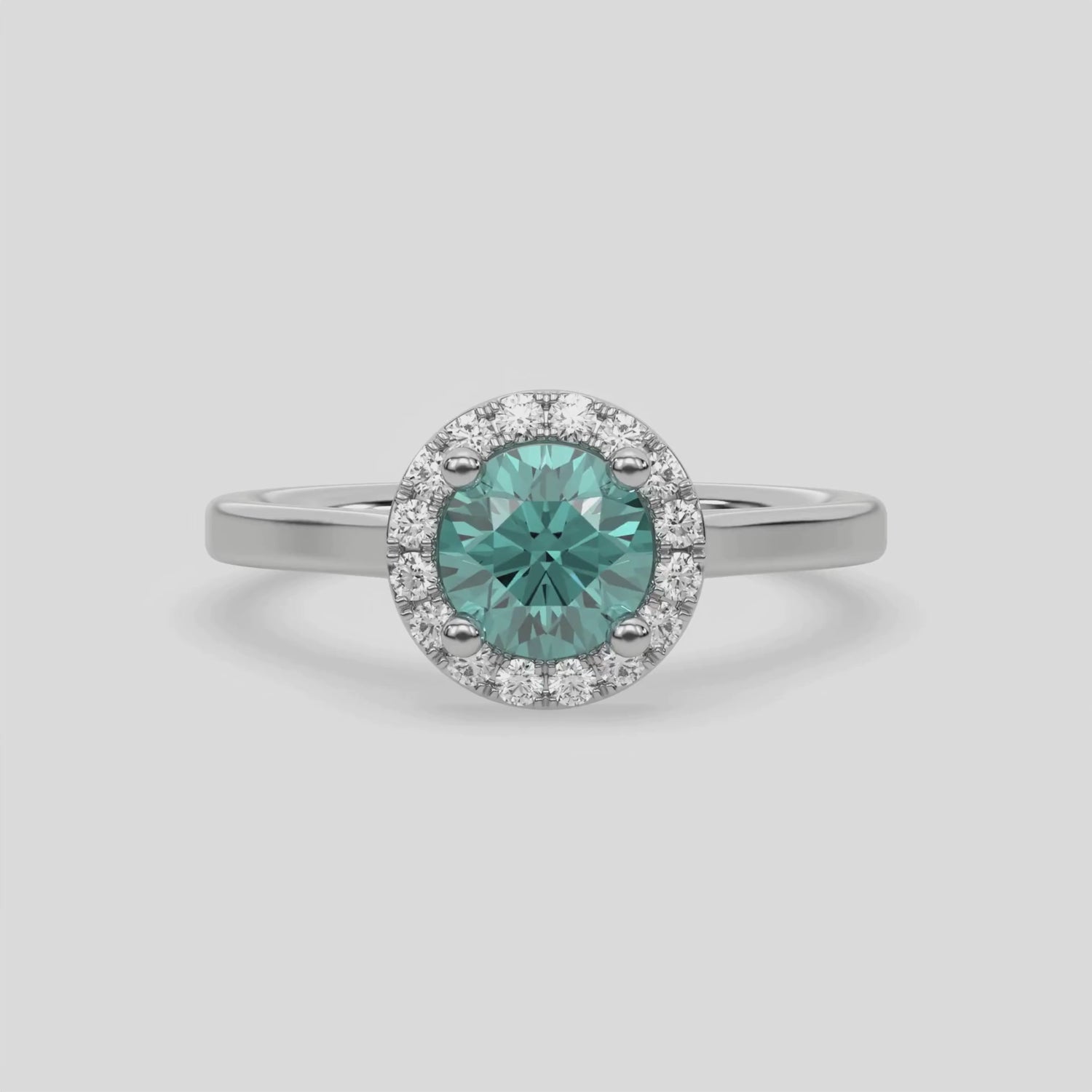 This video features a white gold ring features a fancy Green round solitaire diamond set in a four-prong setting