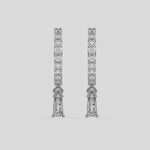 This video features a white gold Dangling Baguette Diamond Hoop Earrings handmade with round brilliant-cut diamonds in prong setting and a baguette solitaire hanging at the bottom