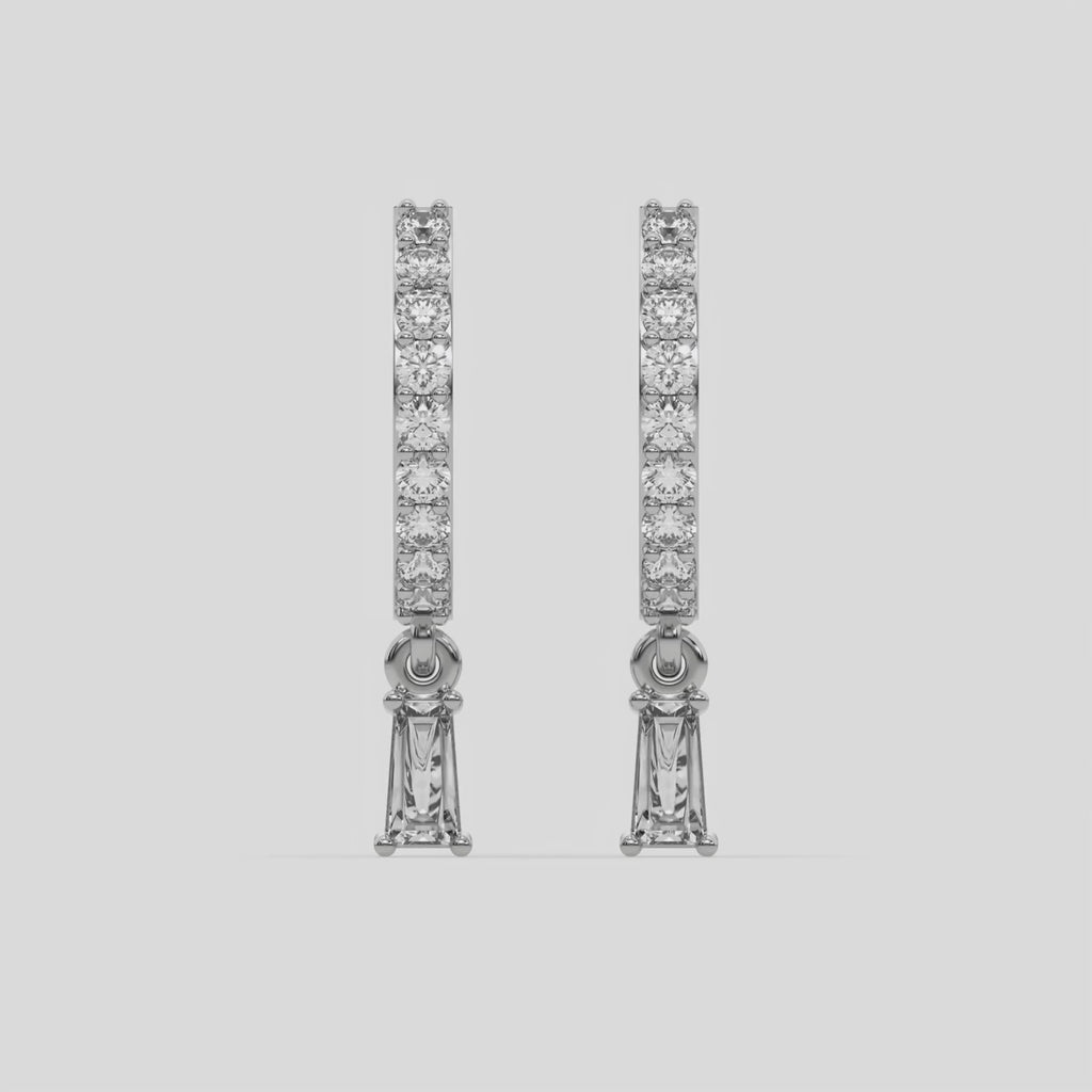 This video features a white gold Dangling Baguette Diamond Hoop Earrings handmade with round brilliant-cut diamonds in prong setting and a baguette solitaire hanging at the bottom