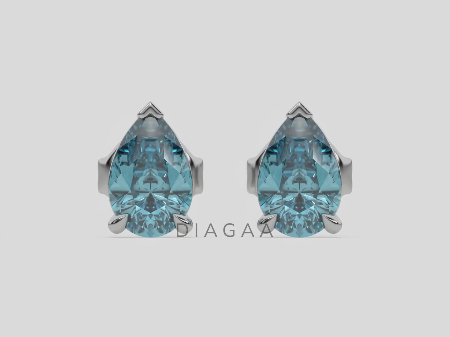 18k white gold pear shaped diamond stud earrings made with a fancy blue pear shaped diamond set in a four prong setting
