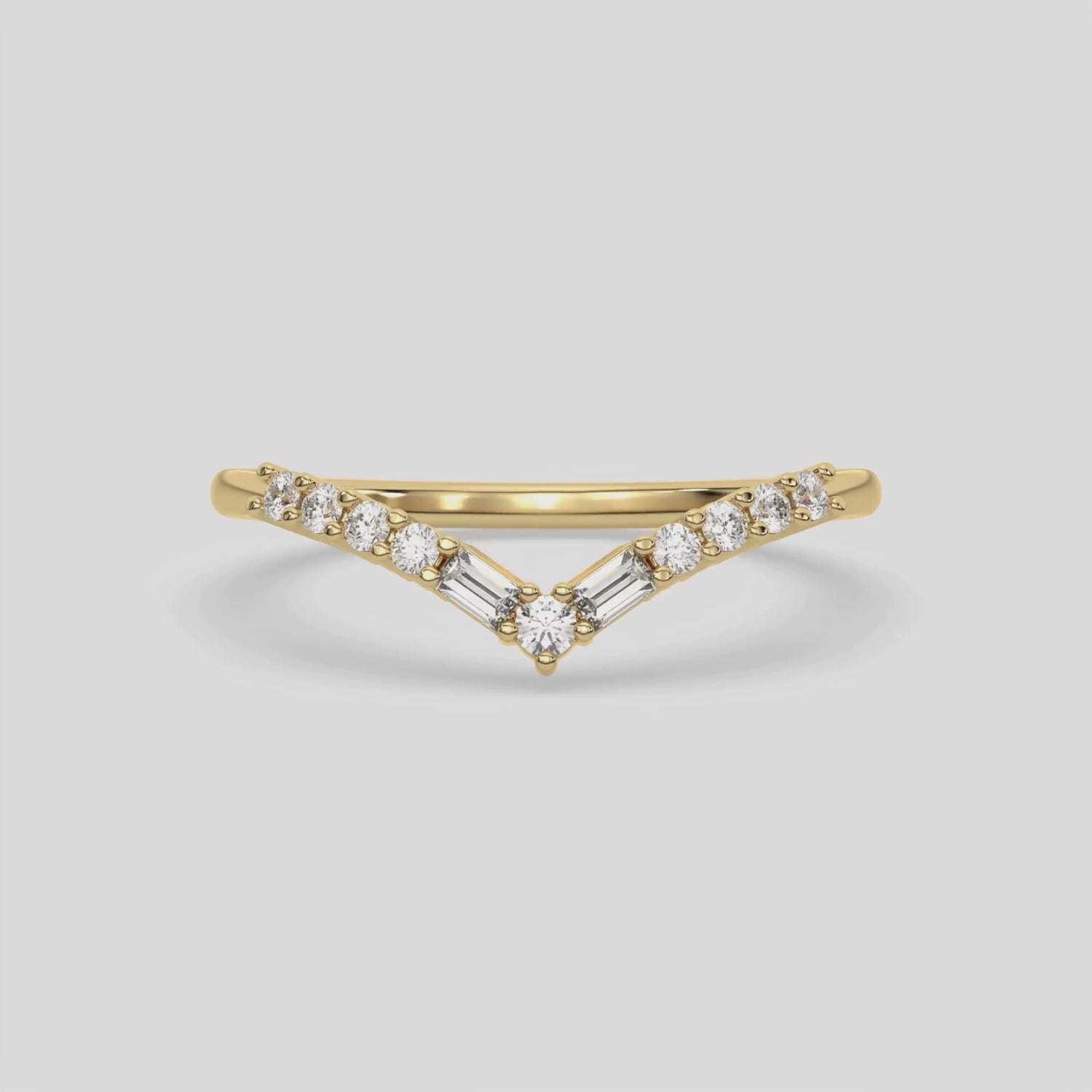 This video features a yellow gold Chevron Diamond Ring handmade with round brilliant-cut diamonds and baguette diamonds all set in a shared prong setting