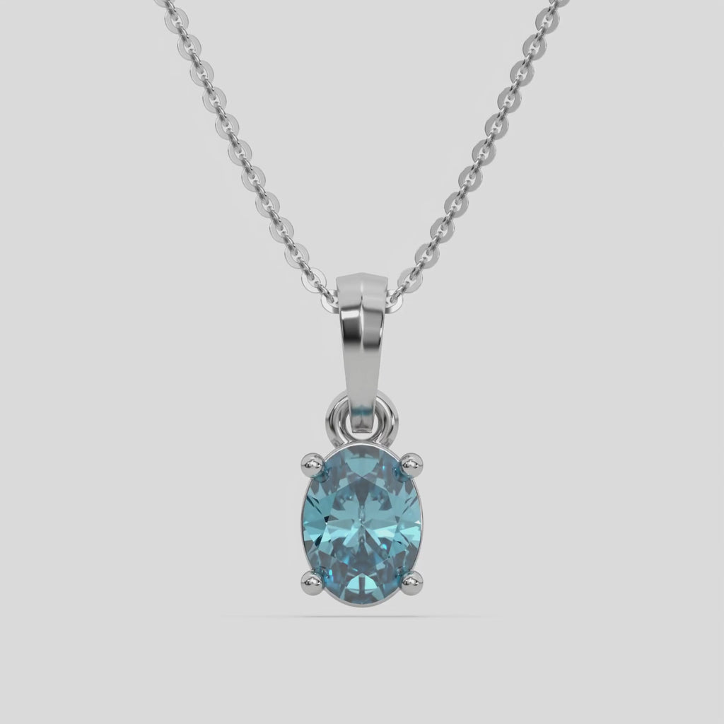 This white gold Fancy Blue Oval Solitaire Diamond Necklace made with an fancy Blue oval cut diamond in a four prong setting with adjustable chain 