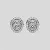 This video features a white gold Classic Oval Diamond Halo Earrings made with an oval-cut solitaire diamonds set in a four prong setting