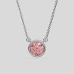 This white gold Fancy Pink Round Solitaire Diamond Necklace made with a fancy Pink round brilliant-cut diamond in bezel setting with adjustable chain 