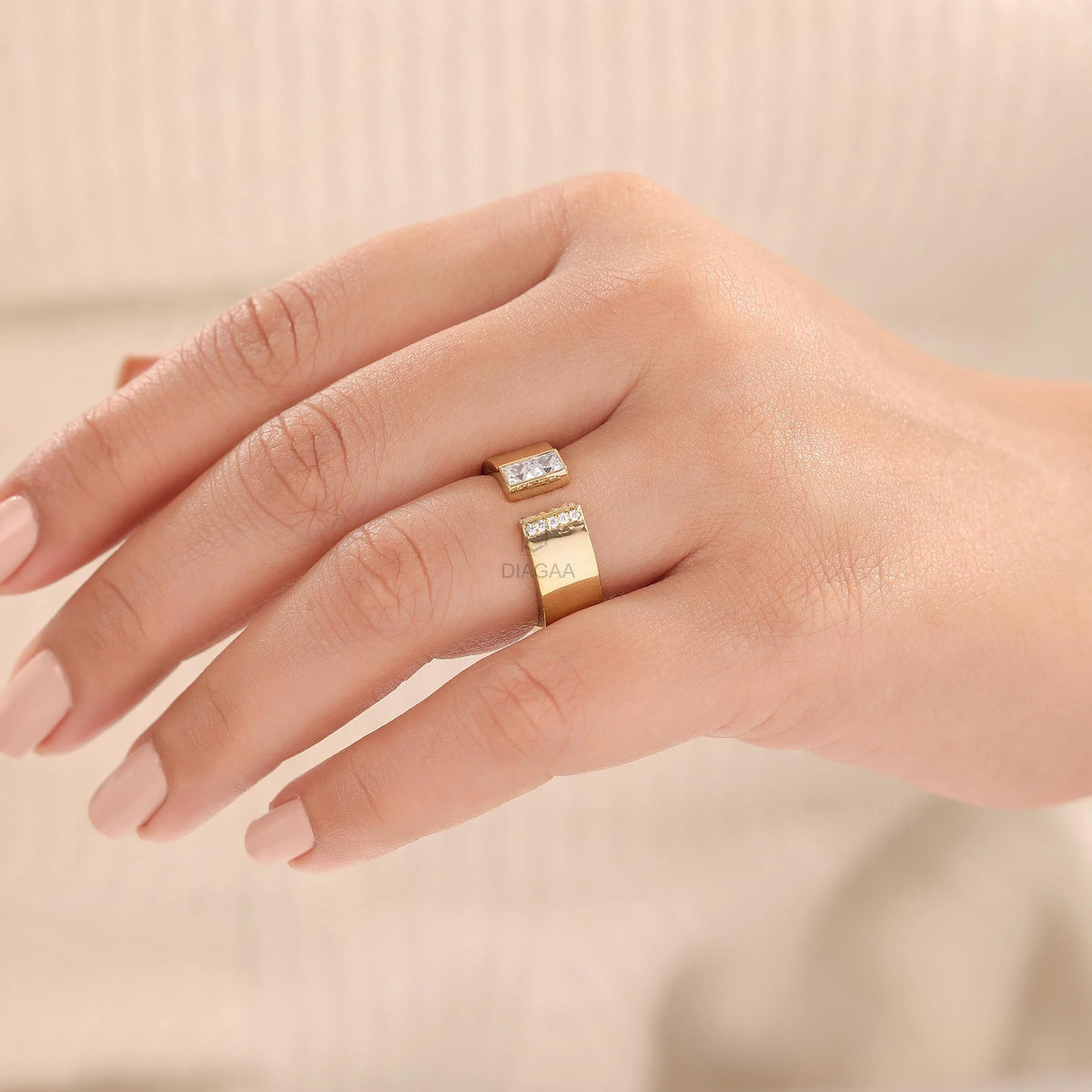 Woman wearing a 14K yellow gold princess diamond open cuff wedding band