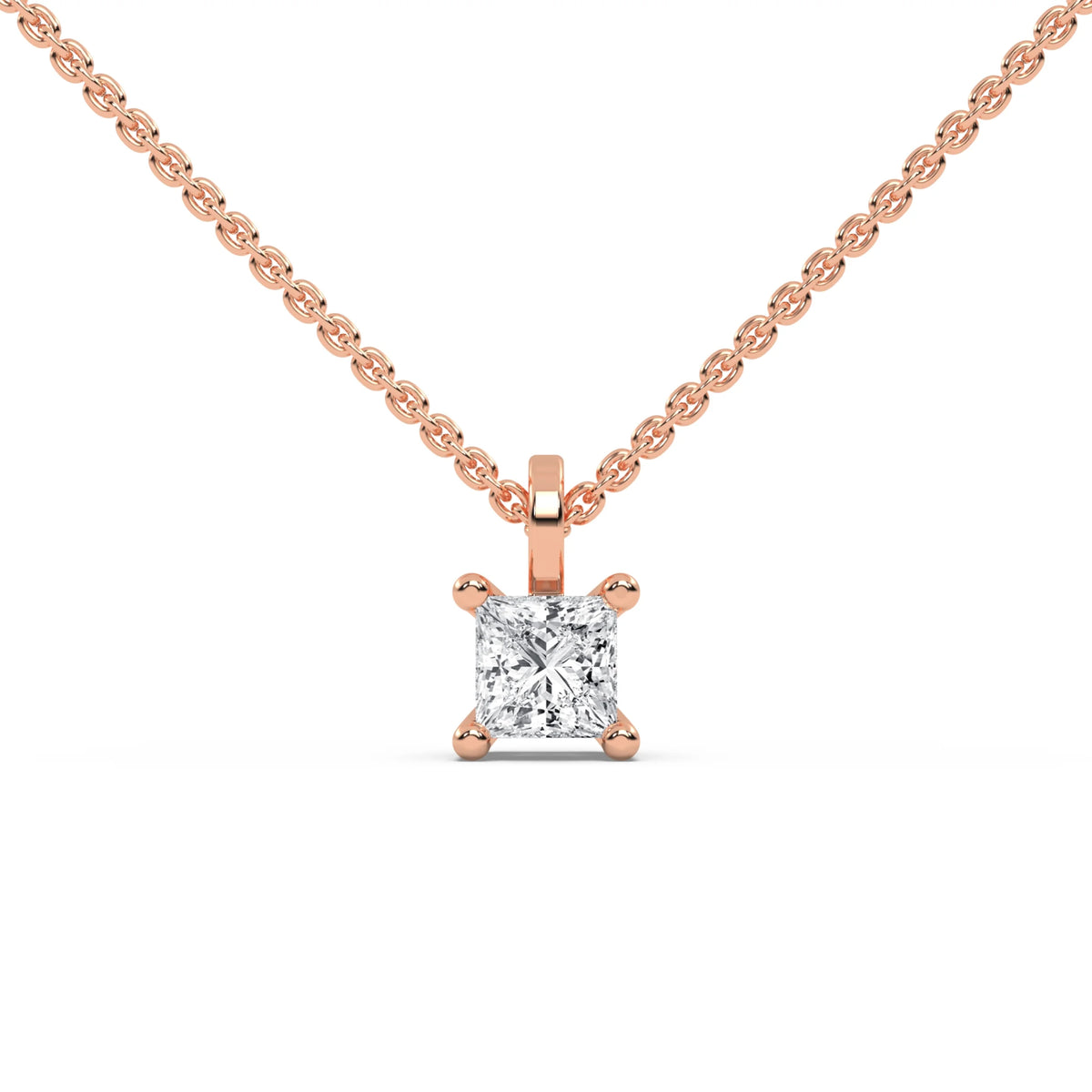 A classic princess diamond necklace featuring a sparkling solitaire pendant. This elegant prong-set design is beautifully crafted in polished rose gold on a delicate chain.