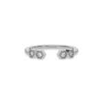 white gold open cuff ring by featuring four round diamonds in geometric hexagonal settings. Modern minimalist gap band.