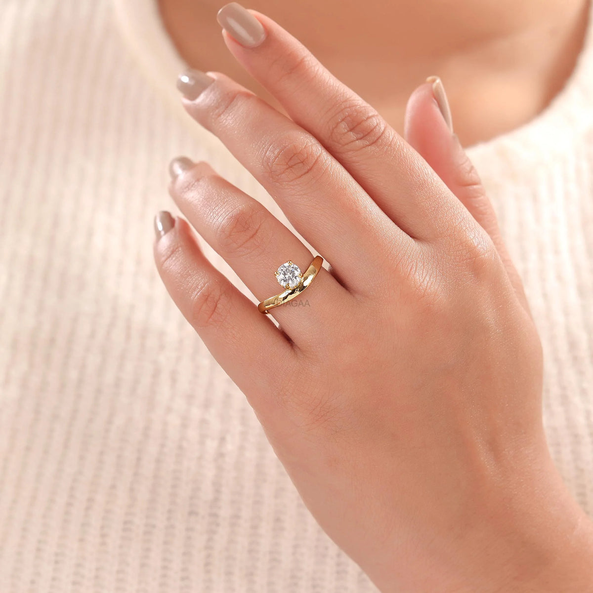 10K yellow gold round diamond solitaire engagement ring with a hidden halo curved band on a woman's hand