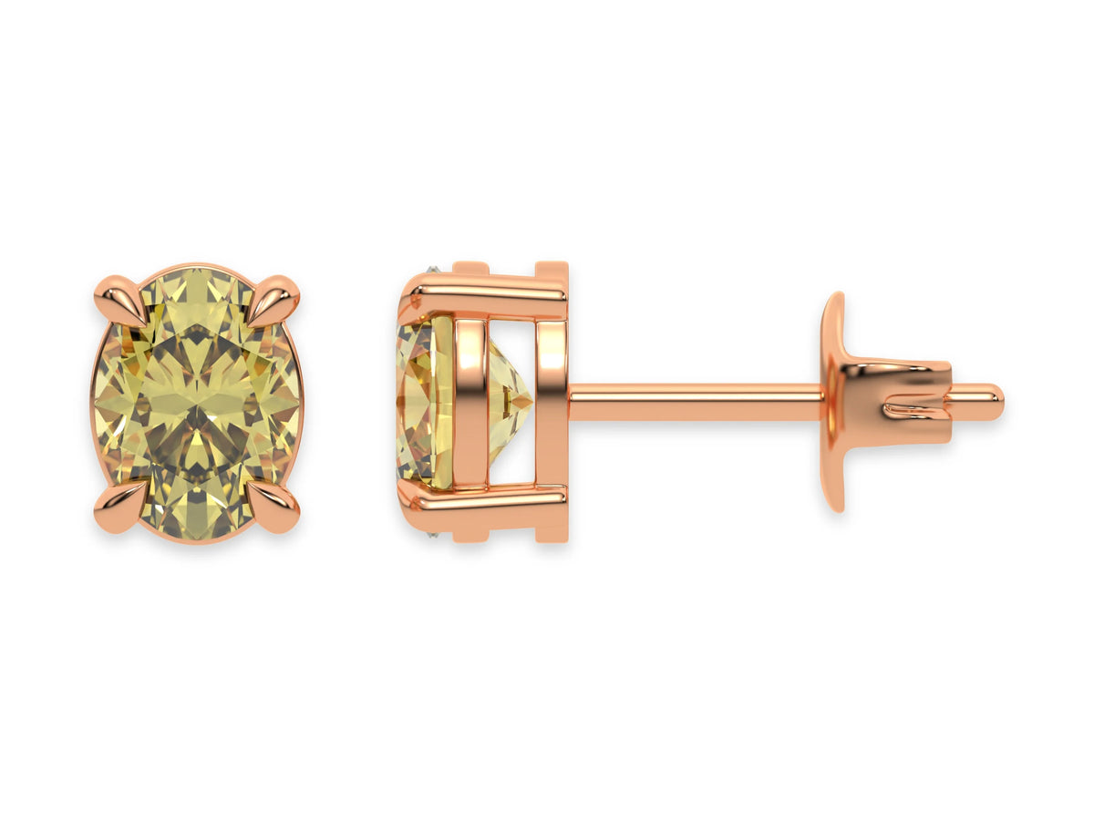 18k rose gold oval diamond stud Earrings made with an fancy yellow oval cut diamond set in a four prong setting