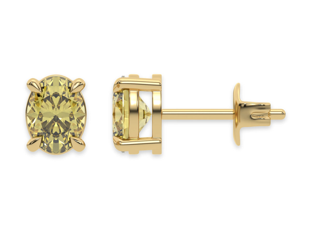 18k yellow gold oval diamond stud Earrings made with an fancy yellow oval cut diamond set in a four prong setting