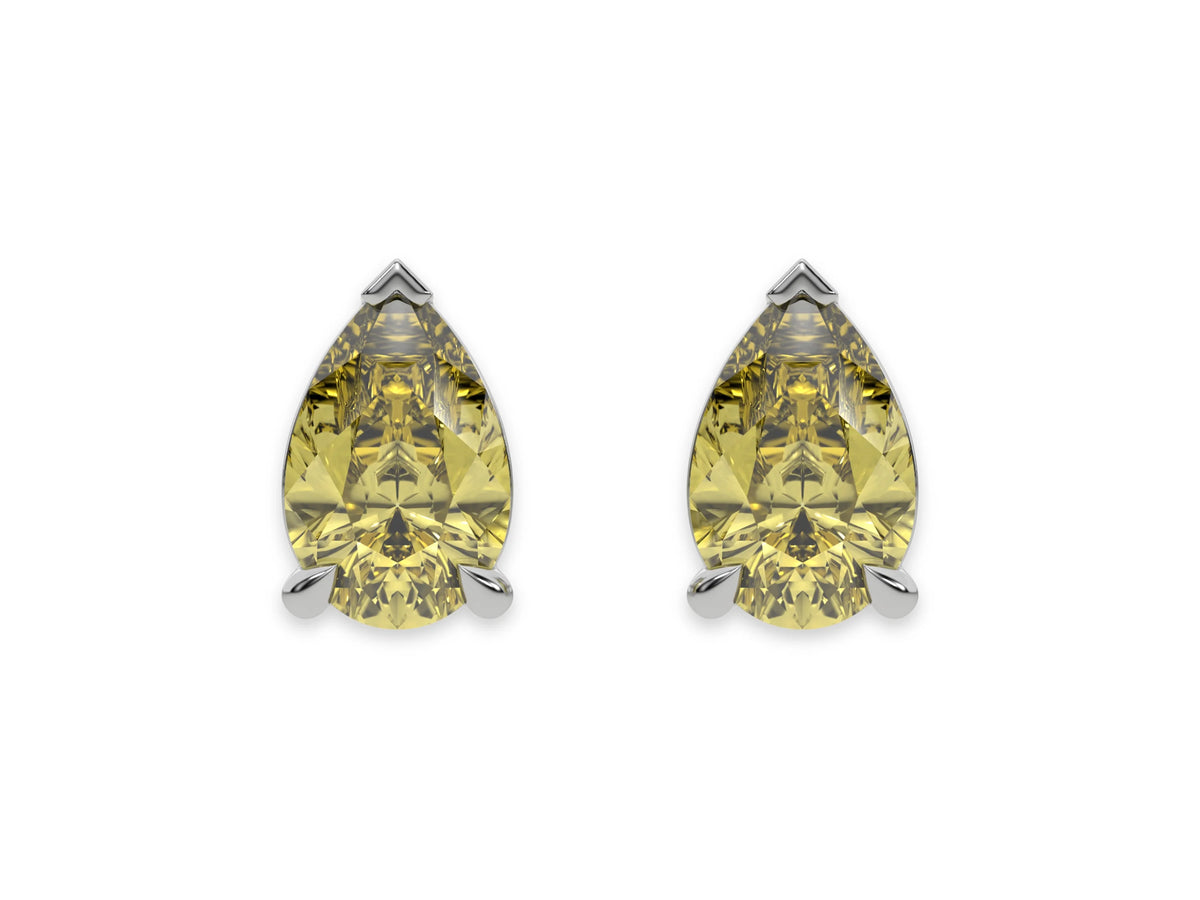 10k white gold Pear shaped diamond Earrings made with a fancy yellow pear shaped diamond set in a four prong setting